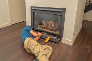 Hearth Service Tech Fixing electric fireplace